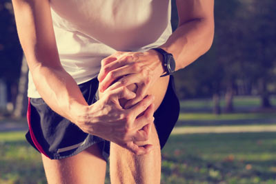 Man holding knee